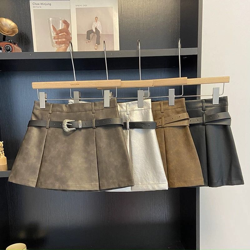 Equipped with a belt, high waisted black pleated anti glare A-line skirt, women's early autumn  Korean version versatile PU leather short skirt