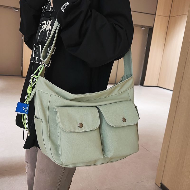 斜挎包女ins日系潮牌大容量郵差包工裝運動休閒單肩包男士上課包