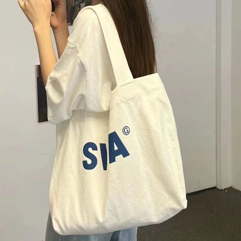 帆布包女單肩休閒通勤大容量ins學生上課包慵懶風小眾布袋拉鏈潮