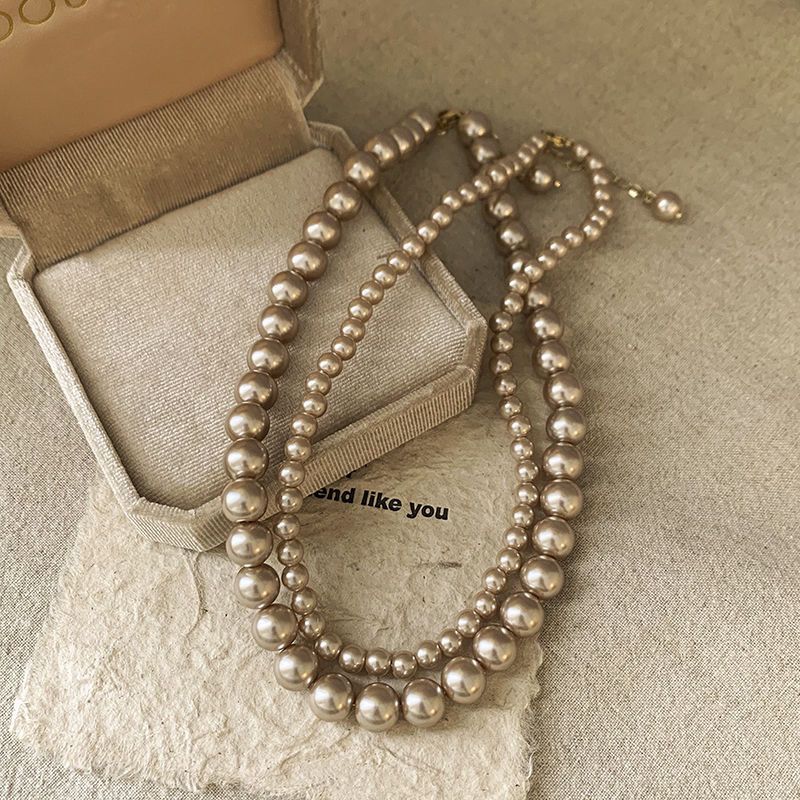 Ni Ni's same champagne color pearl necklace women's niche design light luxury high-end necklace new style temperament sweater chain