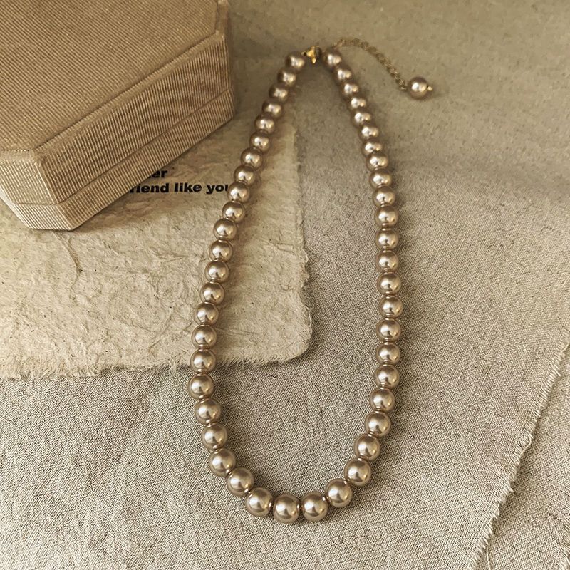 Ni Ni's same champagne color pearl necklace women's niche design light luxury high-end necklace new style temperament sweater chain