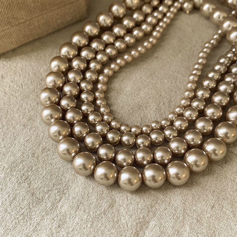 Ni Ni's same champagne color pearl necklace women's niche design light luxury high-end necklace new style temperament sweater chain