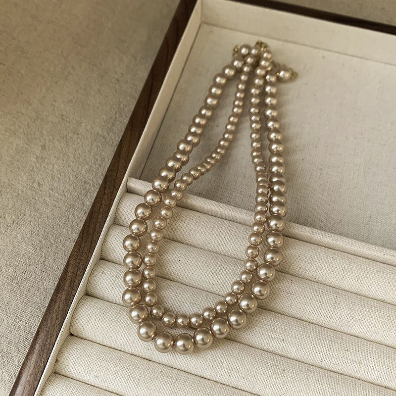 Ni Ni's same champagne color pearl necklace women's niche design light luxury high-end necklace new style temperament sweater chain