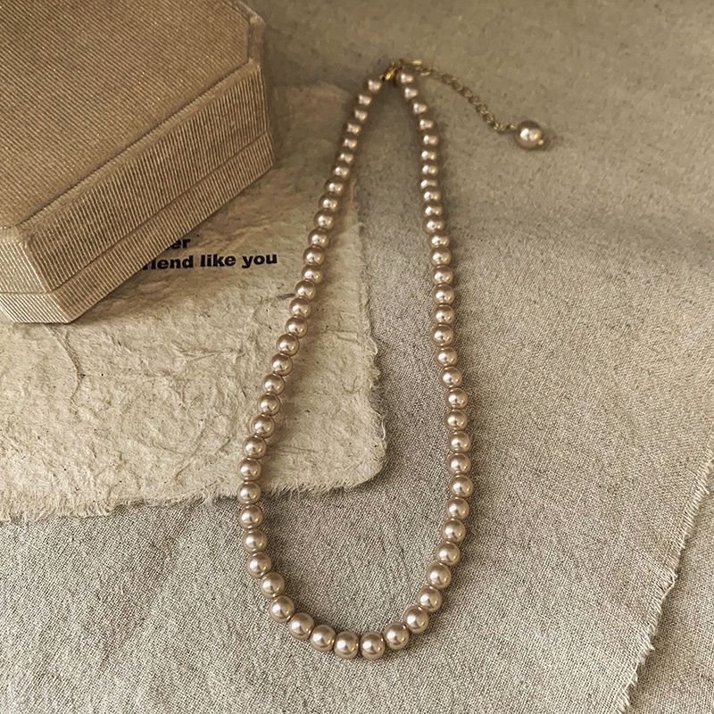 Ni Ni's same champagne color pearl necklace women's niche design light luxury high-end necklace new style temperament sweater chain