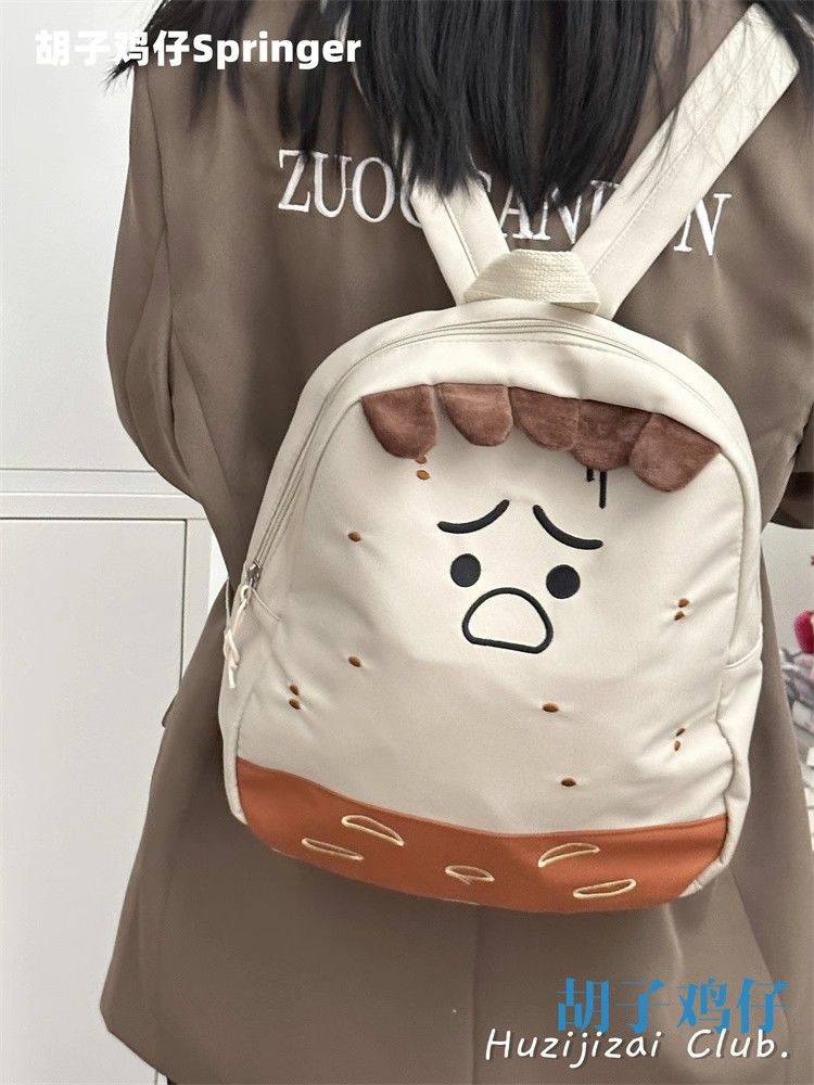 ins Japanese cute canvas backpack female Korean version chic personality ugly cute funny backpack girl student school bag