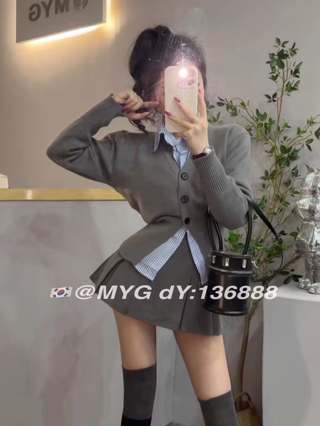 Korean version of sweet college style suit for women in autumn niche v-neck knitted sweater + striped shirt + sexy pleated skirt