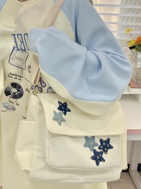大容量斜挎包包女ins學院風百搭星星尼龍帆布包學生上課郵差包潮