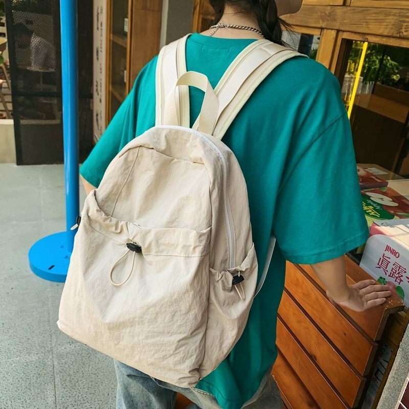 雙肩包女2023新款日系文藝大學生書包防水輕便休閒旅遊抽繩小背包