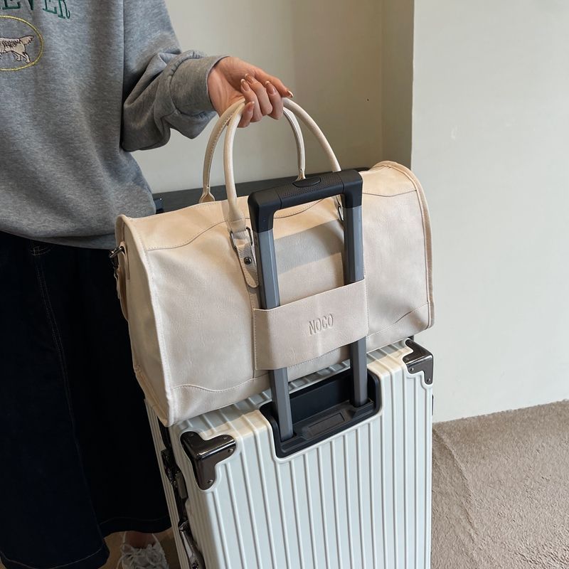 短途旅行包大容量手提登机包收纳袋PU皮轻便运动健身包外出行李袋