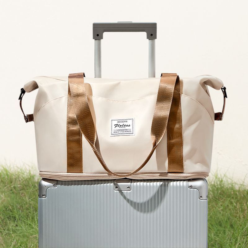 手提旅行收纳袋大容量耐用女轻便行李袋登机包可套拉杆箱健身包
