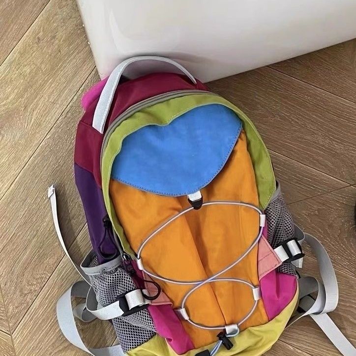 Niche designer regnbue kontrastfarvet rygsæk udendørs fritid vandretaske mænd og kvinders multifunktionelle rejserygsæk bagage_voghion.com