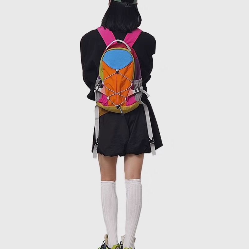 Niche designer regnbue kontrastfarvet rygsæk udendørs fritid vandretaske mænd og kvinders multifunktionelle rejserygsæk bagage_voghion.com
