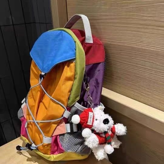 Niche designer regnbue kontrastfarvet rygsæk udendørs fritid vandretaske mænd og kvinders multifunktionelle rejserygsæk bagage_voghion.com