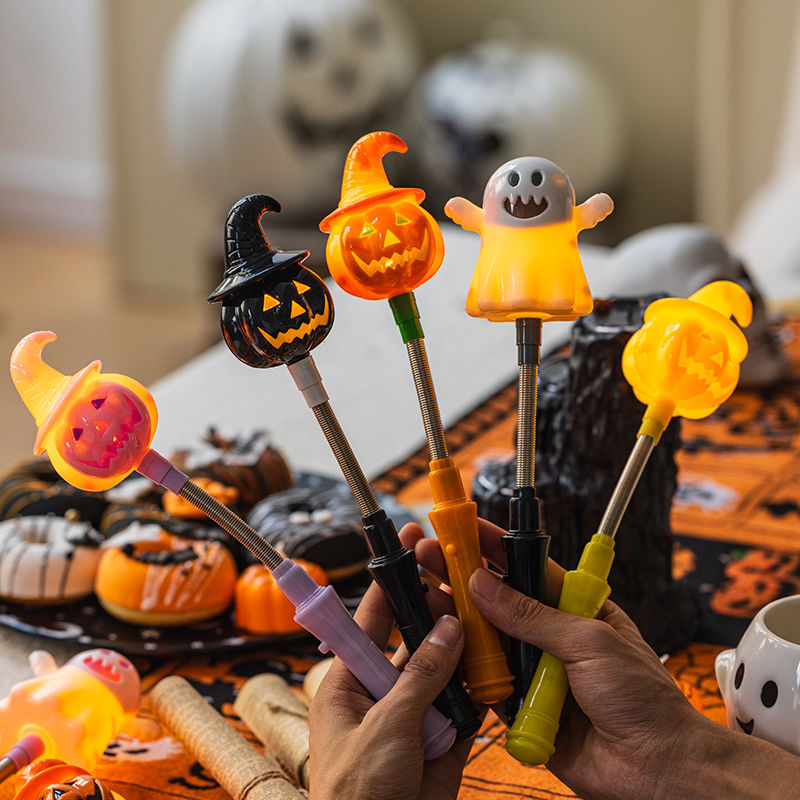 Halloween pumpkin lanterns, glowing hand cranked sticks, decorative props, ghost children's gifts, bar party scene_voghion.com