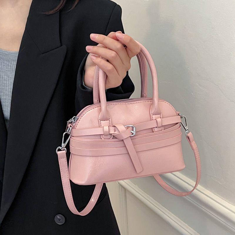 Elegante borsa a mano di tendenza in pelle cerata a forma di conchiglia, nuovo prodotto 2025, versatile per uscire, fare shopping e_voghion.com