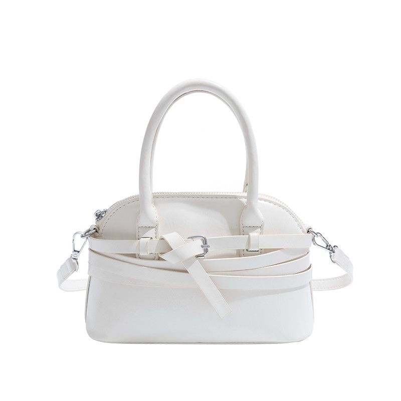 Elegante borsa a mano di tendenza in pelle cerata a forma di conchiglia, nuovo prodotto 2025, versatile per uscire, fare shopping e_voghion.com