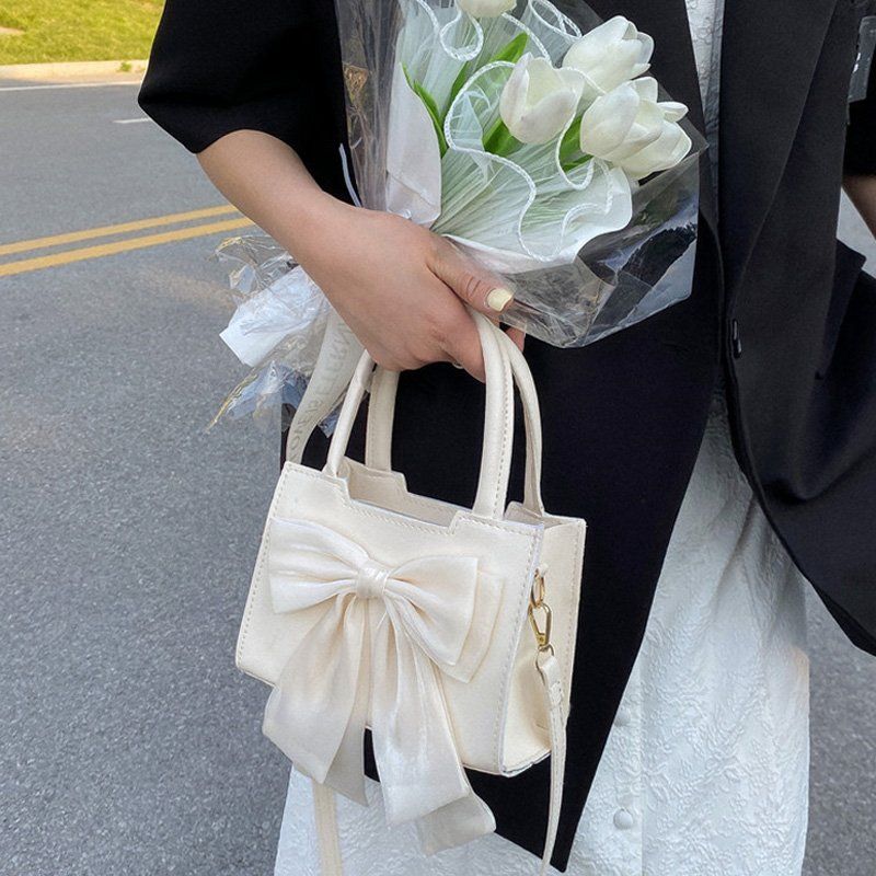 高級感小眾設計蝴蝶結斜挎小包包女2022新款潮復古百搭單肩小方包