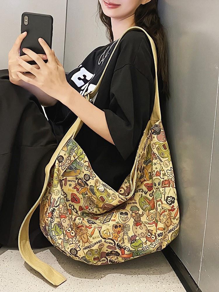 大容量帆布包包女2023新款小眾可愛塗鴉單肩斜挎包通勤上課托特包