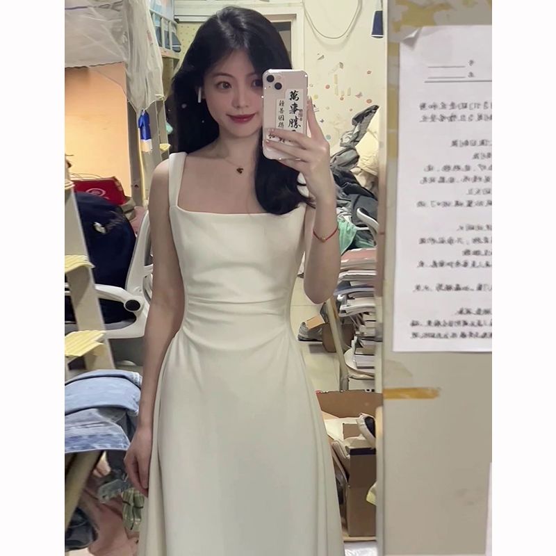 法式氣質赫本風白色吊帶連衣裙子女夏季2023新款收腰a字長裙高級