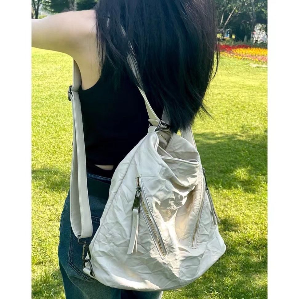Korean pastoral 2023 new wide shoulder strap pleated commuter backpack women's high-end single shoulder crossbody bag