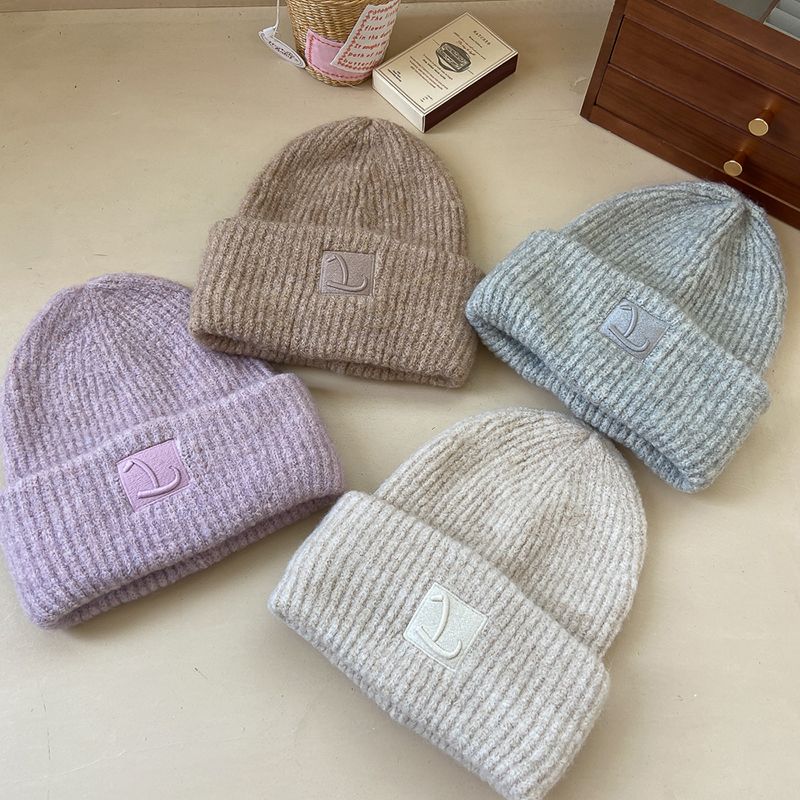 Loose wool knitted hat, simple and fashionable, solid color, cold and warm wool hat, showing a small pile of ear_voghion.com