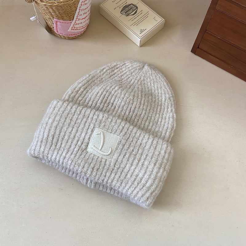 Loose wool knitted hat, simple and fashionable, solid color, cold and warm wool hat, showing a small pile of ear_voghion.com