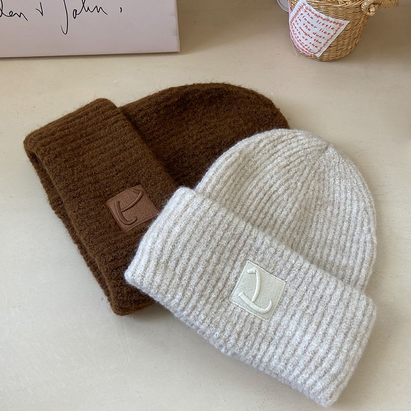 Loose wool knitted hat, simple and fashionable, solid color, cold and warm wool hat, showing a small pile of ear_voghion.com