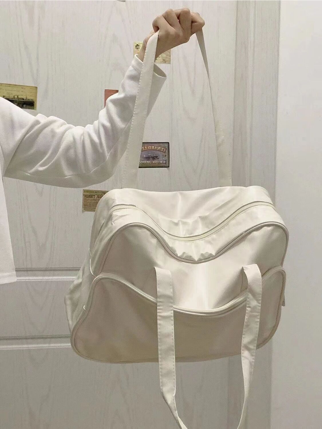 2023 New niche design soft leather large capacity commuting bag, short distance travel handbag, fashionable solid color shoulder bag