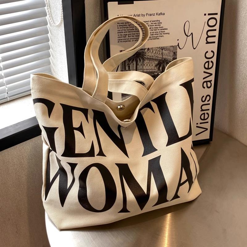 Large-capacity letter canvas bag for women in autumn and winter new style internet celebrity fashion shoulder tote bag outing portable shopping bag
