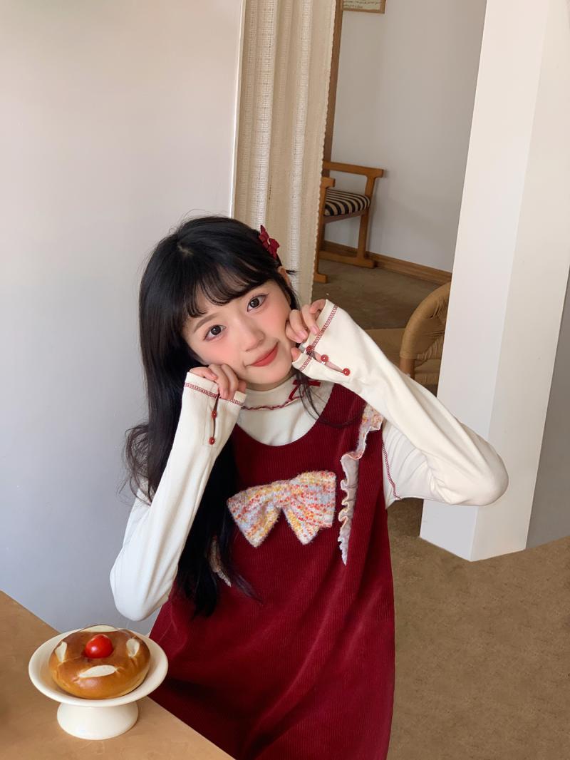 甜美復古蝴蝶結背心裙女秋冬時尚設計感小眾寬鬆休閒飛飛袖連衣裙