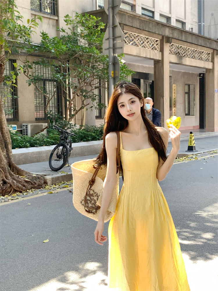 Gentle style yellow suspender dress for women summer French style waist slimming A-line skirt seaside vacation long dress