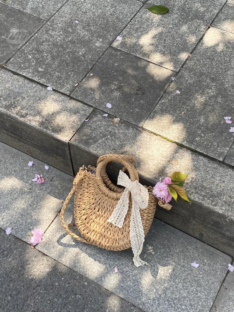 蝴蝶結斜挎草編包女2024夏季新款森系手提菜籃子包度假沙灘編織包