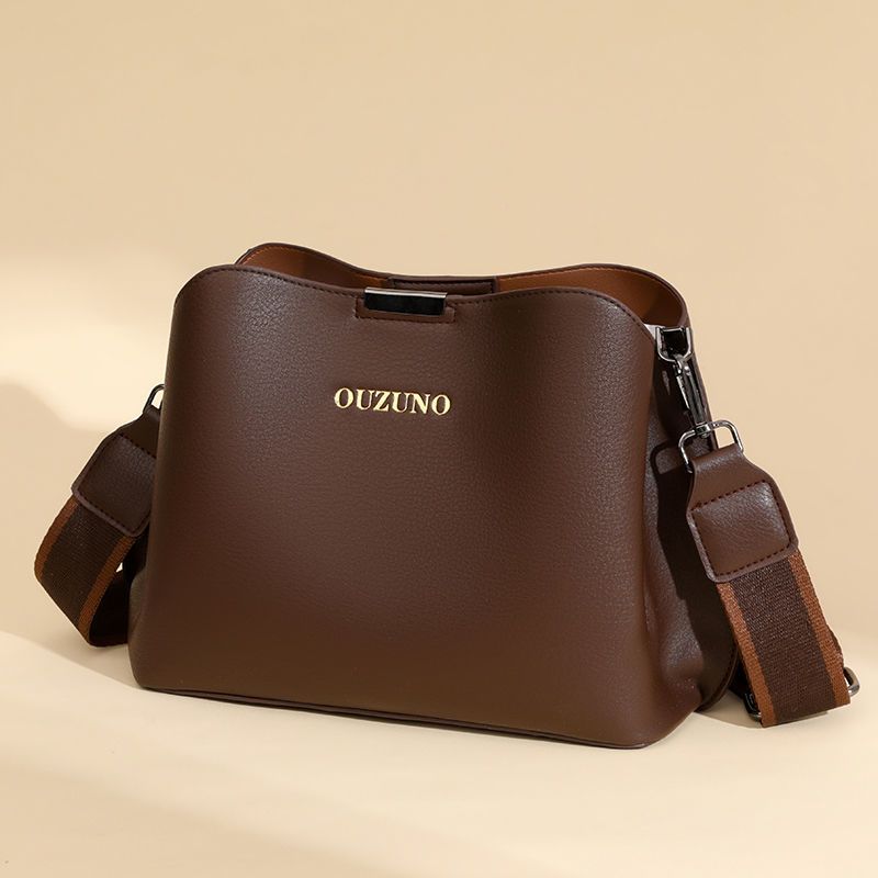 [Jian Neng] Bolso tipo cubo de moda 2025 para mujeres de mediana edad, bolso bandolera de un solo hombro, versátil, de piel suave._voghion.com